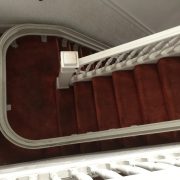 View from upper landing of stairlift rail turning at mid landing.