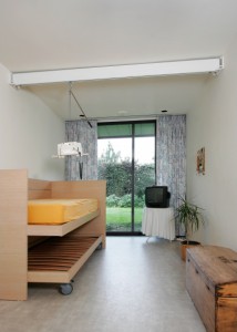 Surehands Wall-to-Wall Track System spanning bedroom.