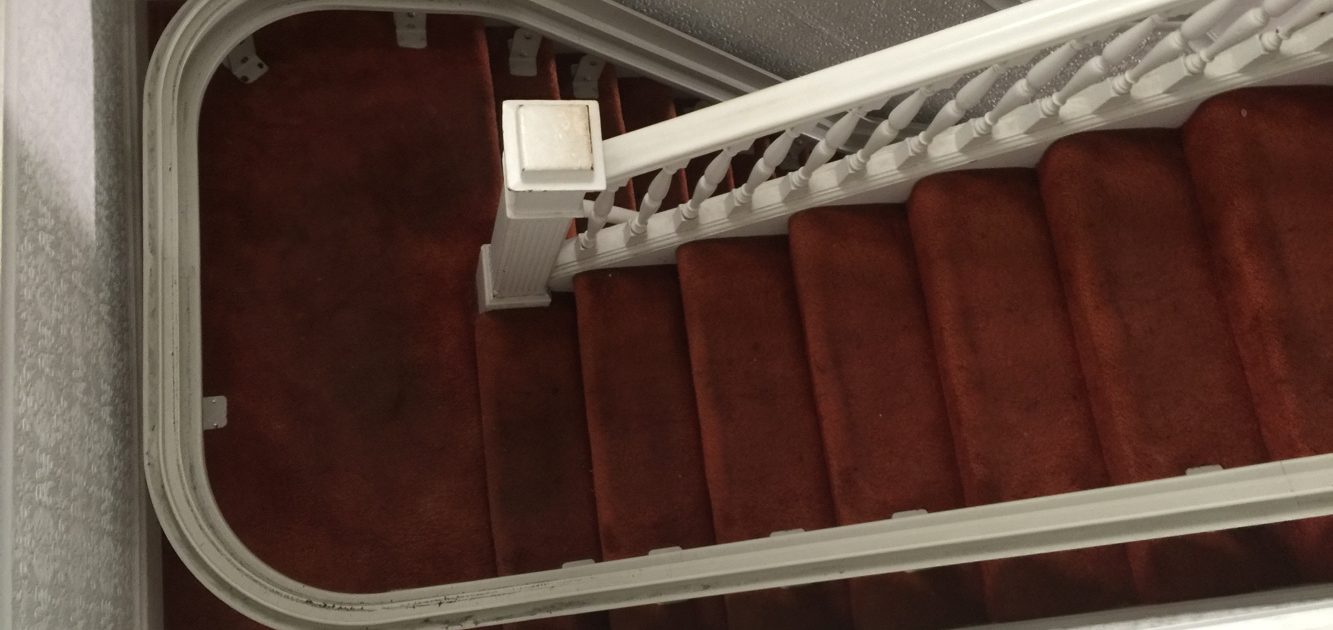 View from upper landing of stairlift rail turning at mid landing.