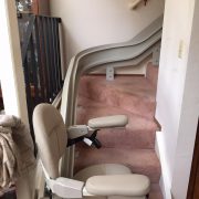 Titone Project: Stairlift at bottom landing, arms lowered.