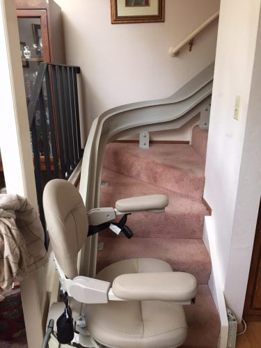 Titone Project: Stairlift at bottom landing, arms lowered.